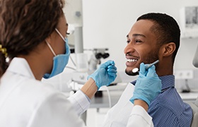 Male patient visiting his dentist for a checkup 