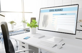 Dental insurance form on desktop in office