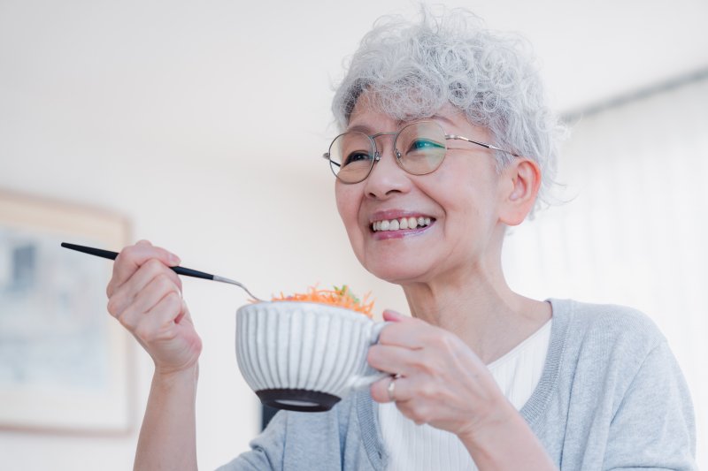 an older woman eating lunch